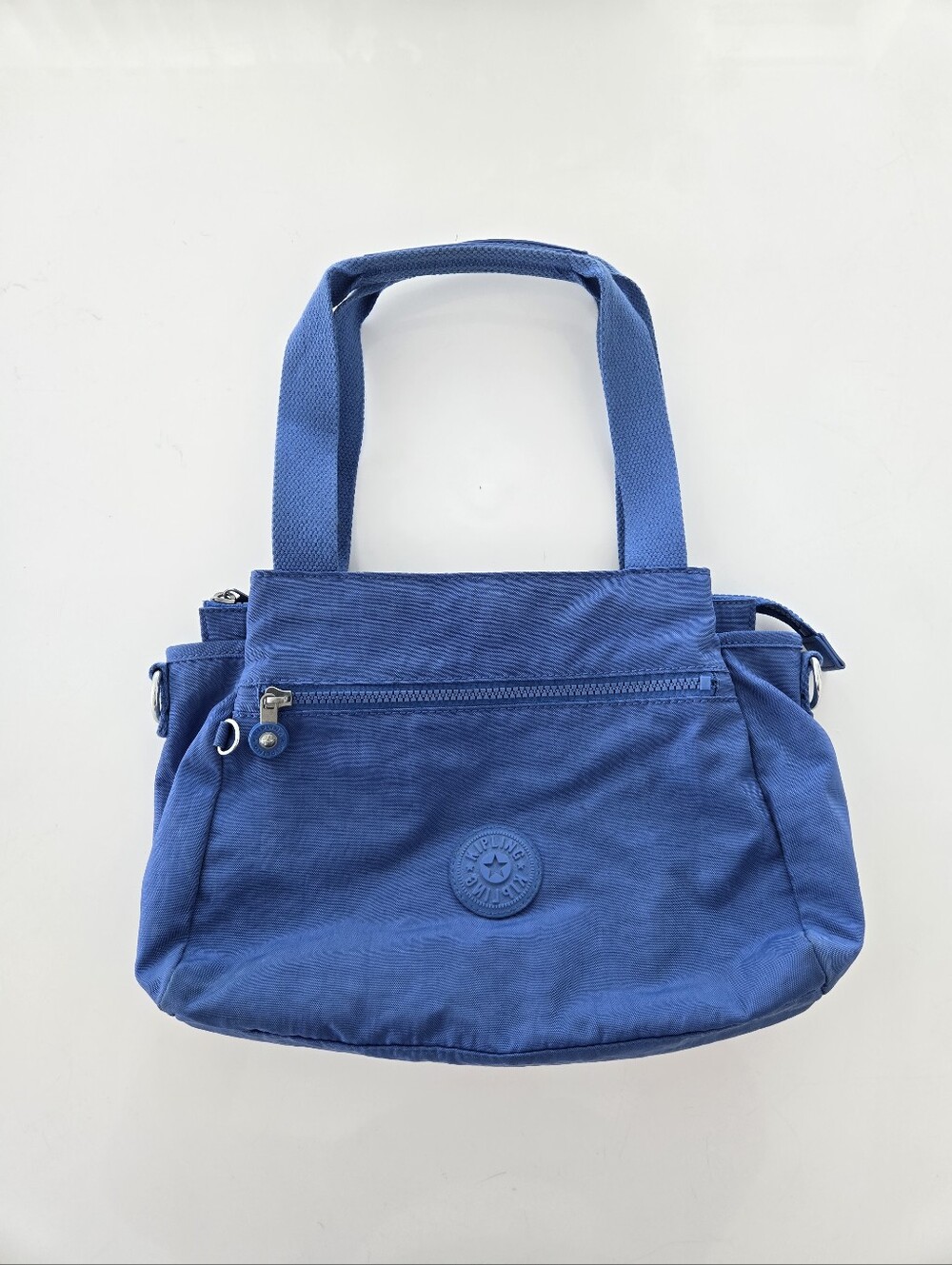 Kipling Blue Satchel Top Handle Bag did not come with Monkey Charm, not Strap.